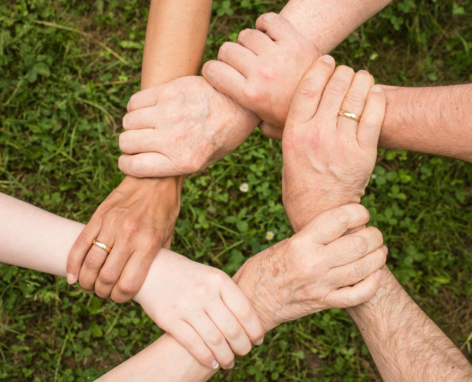 Hands meeting in solidarity